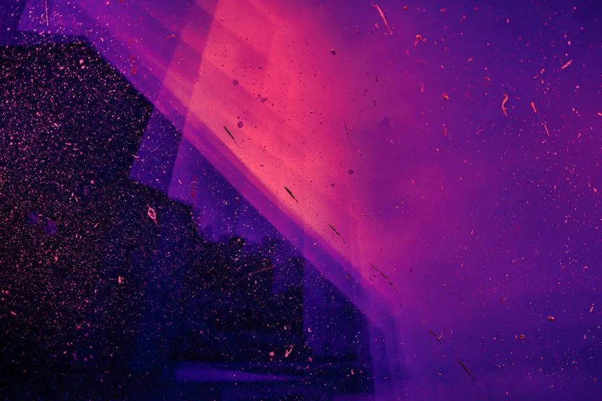 Abstract pink and purple light with sparkling particles